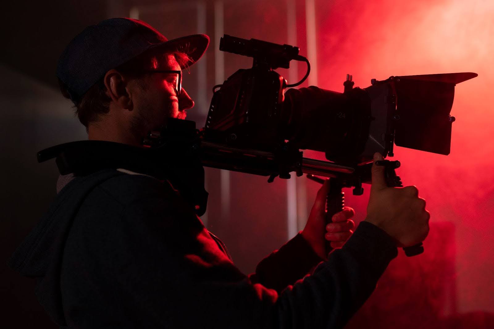 camera man in red studio